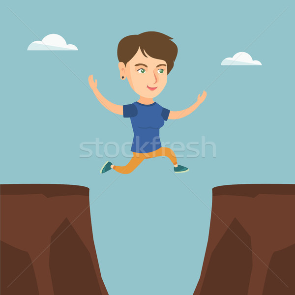 Young caucasian sportswoman jumping over the cliff Stock photo © RAStudio