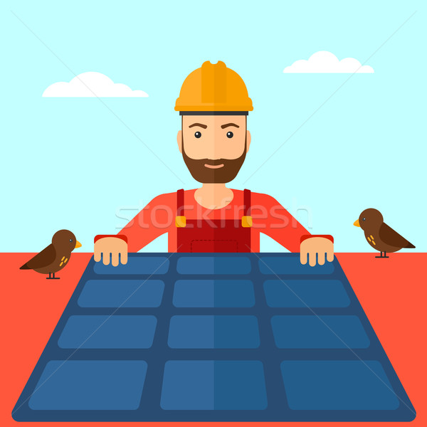 Constructor with solar panel. Stock photo © RAStudio