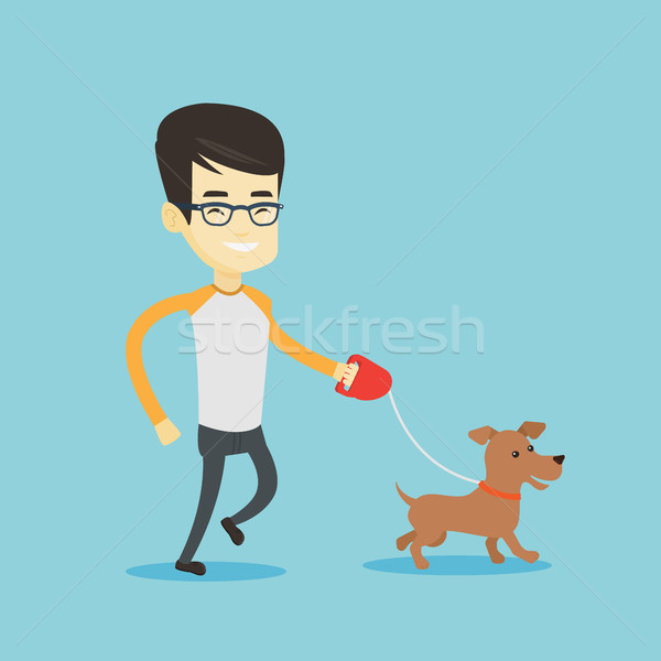 Young man walking with his dog. Stock photo © RAStudio