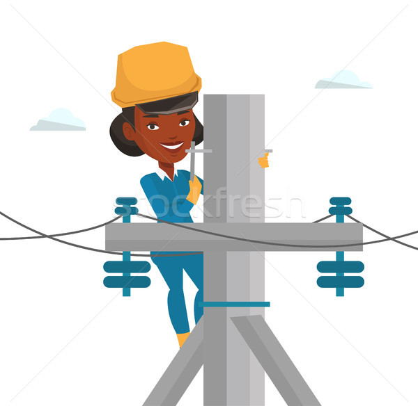 Electrician working on electric power pole. Stock photo © RAStudio