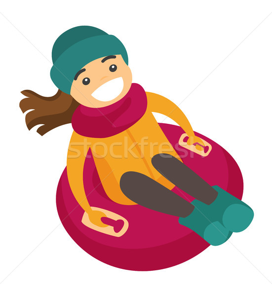 Caucasian woman sledding down on snow rubber tube. Stock photo © RAStudio
