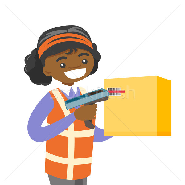 African warehouse worker scanning barcode on box. Stock photo © RAStudio