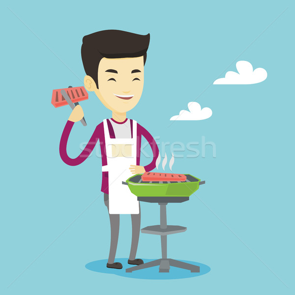 Man cooking steak on barbecue grill. Stock photo © RAStudio