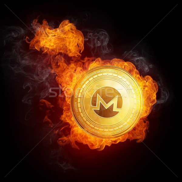 Stock photo: Golden Monero coin falling in fire flame.