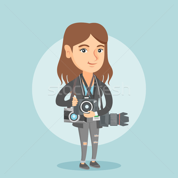 Young caucasian photographer with photo cameras. Stock photo © RAStudio