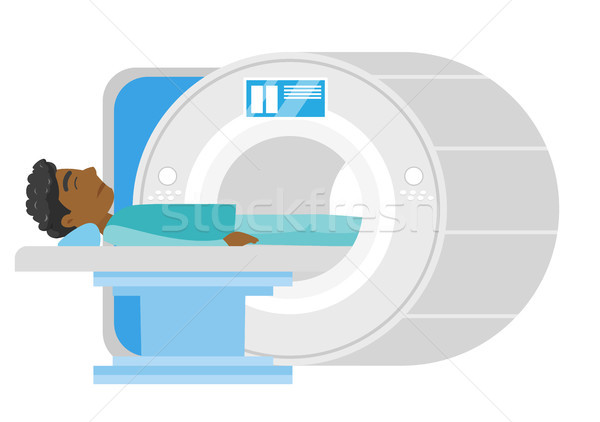 Man undergoes a magnetic resonance imaging scan. Stock photo © RAStudio