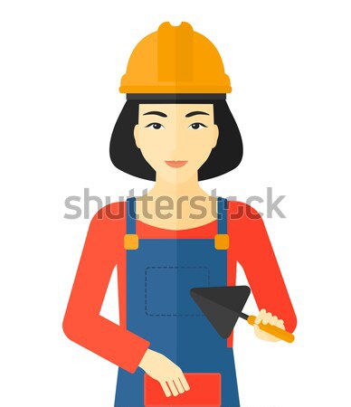 Bricklayer with spatula and brick. Stock photo © RAStudio