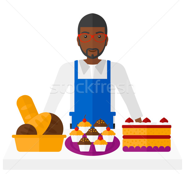 Sikeres kisvállalkozás tulajdonos áll asztal sütemény Stock fotó © RAStudio