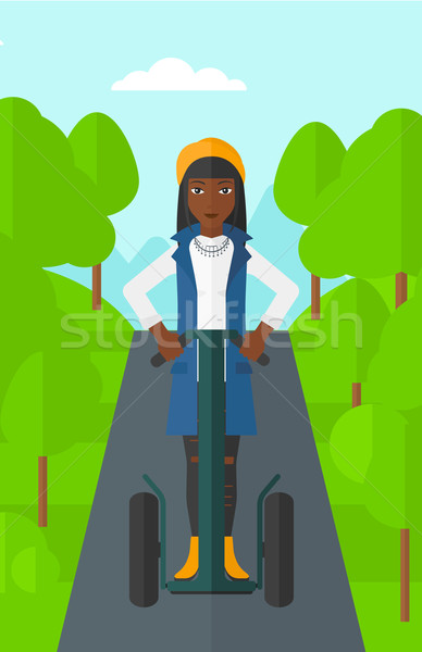 Woman riding on electric scooter. Stock photo © RAStudio