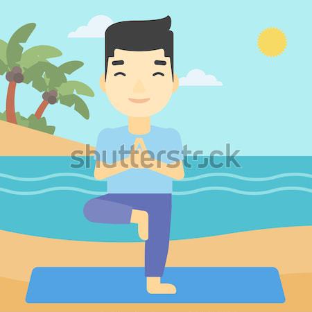 Stock photo: Man meditating in lotus pose.