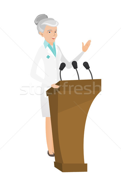 Caucasian doctor giving a speech from tribune. Stock photo © RAStudio