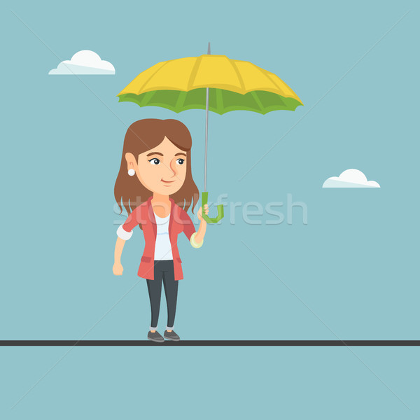 Kafkas iş kadını dengeleme ip yürüyüş şemsiye Stok fotoğraf © RAStudio