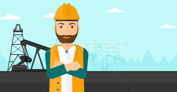 Ölarbeiter Hipster Mann Helm stehen Arme Stock foto © RAStudio