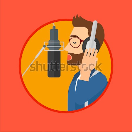 商業照片: 歌手 · 歌曲 · 男子 · 頭戴耳機 · 歌唱