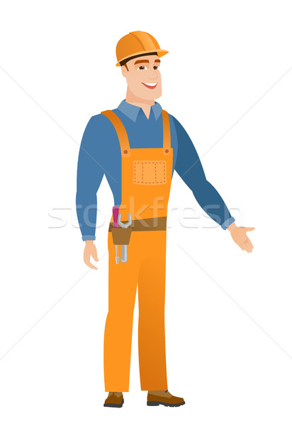 Builder with arm out in a welcoming gesture. Stock photo © RAStudio