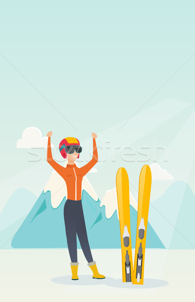 Młodych narciarz stałego podniesionymi rękami góry Zdjęcia stock © RAStudio