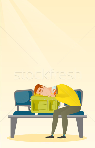 Exhausted man sleeping on suitcase at the airport. Stock photo © RAStudio