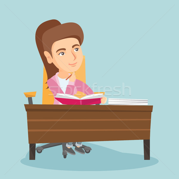 Young student sitting at the table and thinking. Stock photo © RAStudio
