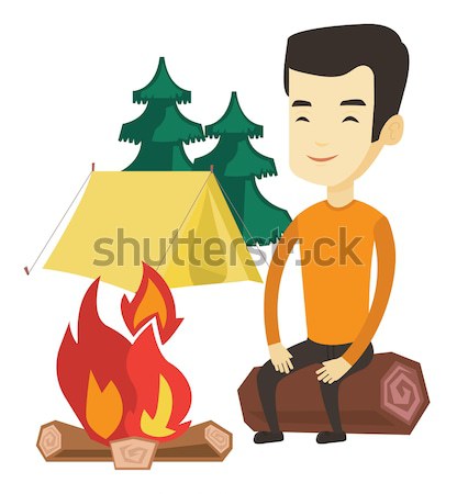 Woman roasting marshmallow over campfire. Stock photo © RAStudio