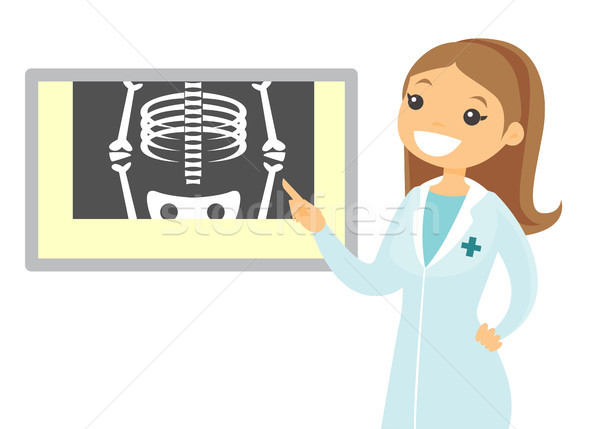 Caucasian radiologist doctor examining radiograph. Stock photo © RAStudio