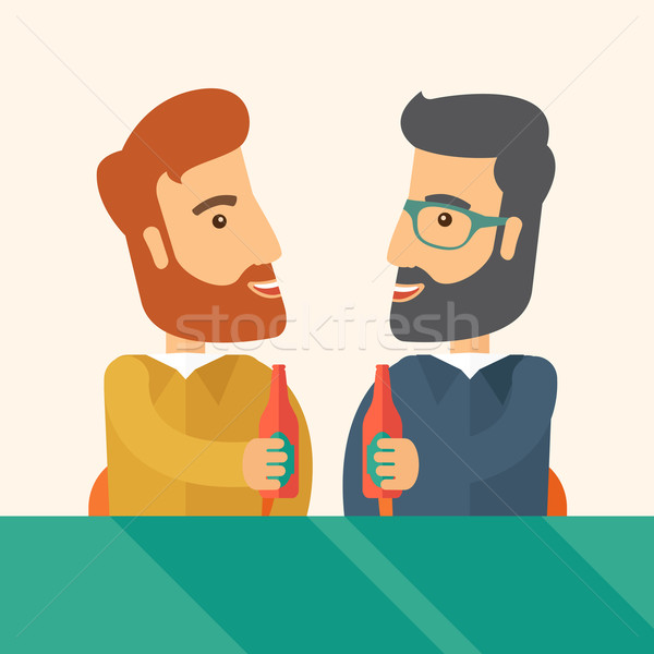 Stock photo: Two co- workers having fun drinking beer in a pub.