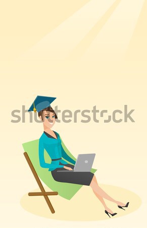 Graduate lying in chaise lounge with laptop. Stock photo © RAStudio