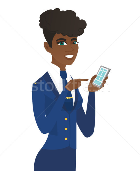 Arican-american stewardess holding a mobile phone. Stock photo © RAStudio