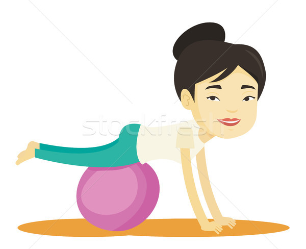 Young woman exercising with fitball. Stock photo © RAStudio