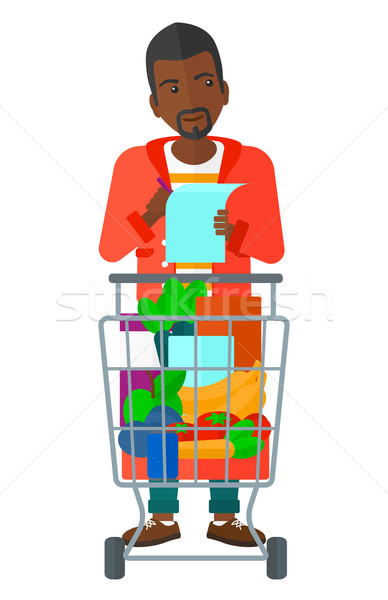 Stock photo: Man with shopping list. 