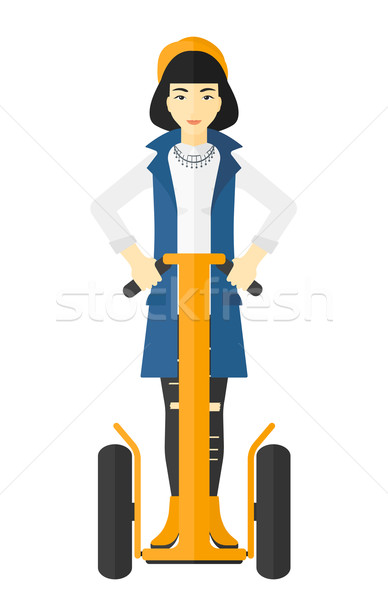 Woman riding on electric scooter. Stock photo © RAStudio