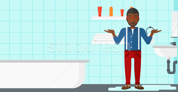 Man in despair standing near leaking sink. Stock photo © RAStudio