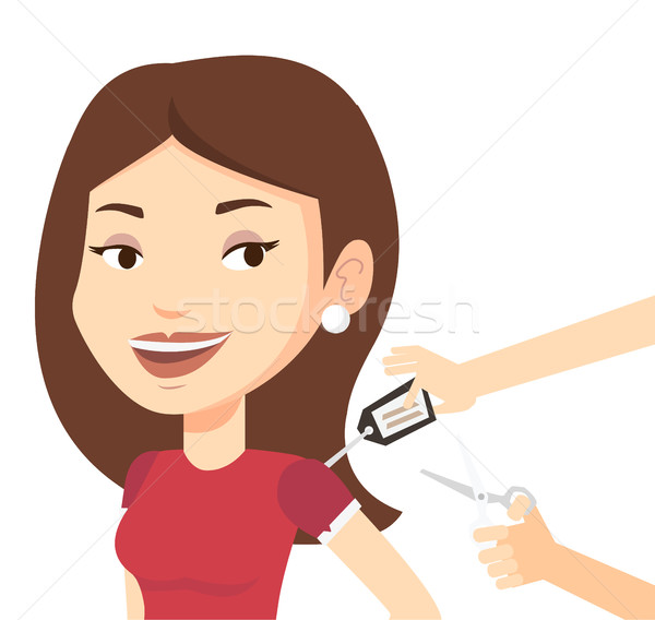 Woman cutting price tag off new t-shirt. Stock photo © RAStudio