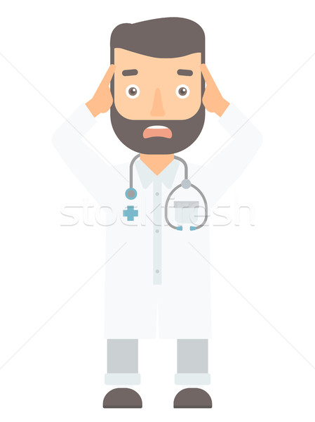 Scared doctor clutching his head. Stock photo © RAStudio