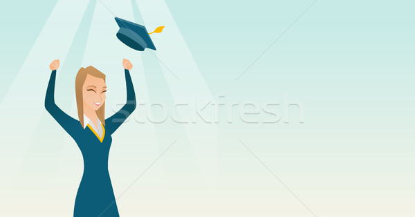 Graduate throwing up graduation hat. Stock photo © RAStudio