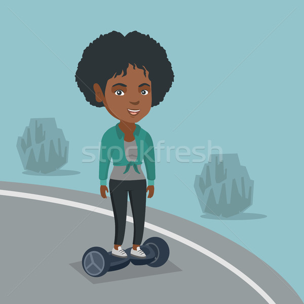 Woman riding a self-balancing electric scooter. Stock photo © RAStudio