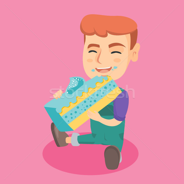 Little caucasian happy boy eating a piece of cake. Stock photo © RAStudio