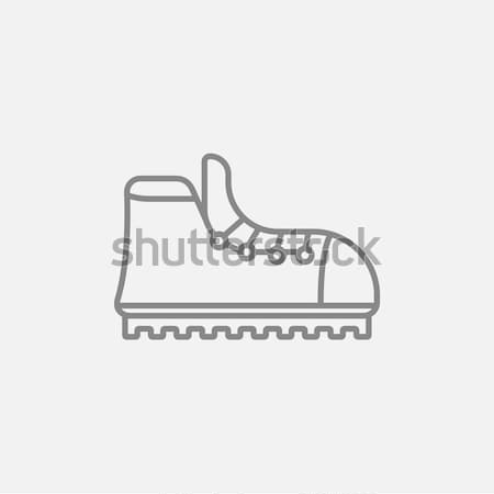 Hiking boot with crampons line icon. Stock photo © RAStudio