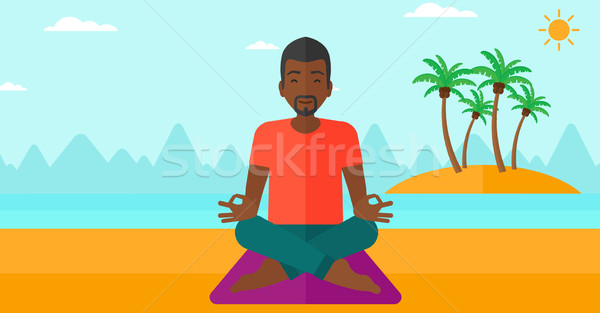 Man meditating in lotus pose. Stock photo © RAStudio
