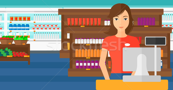 Saleslady standing at checkout. Stock photo © RAStudio