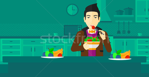 Man eating salad. Stock photo © RAStudio