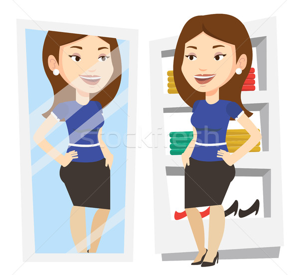 Woman trying on clothes in dressing room. Stock photo © RAStudio