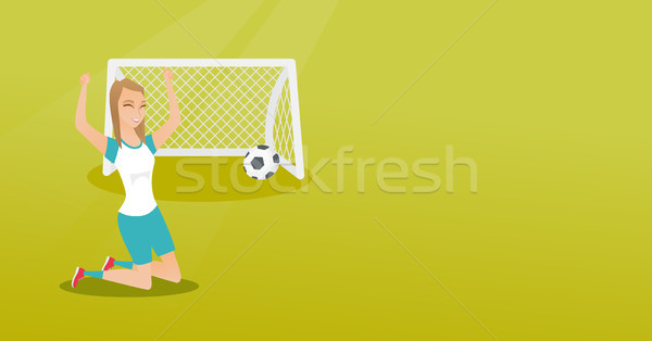Young caucasian soccer player celebrating a goal. Stock photo © RAStudio
