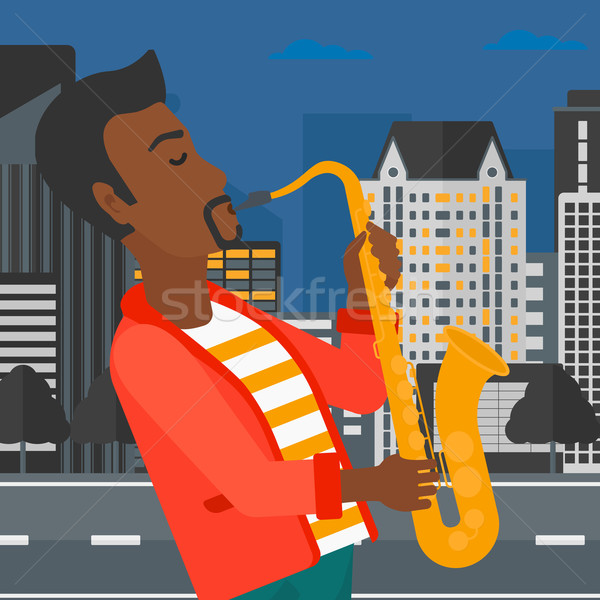 Musicien jouer saxophone homme nuit ville [[stock_photo]] © RAStudio