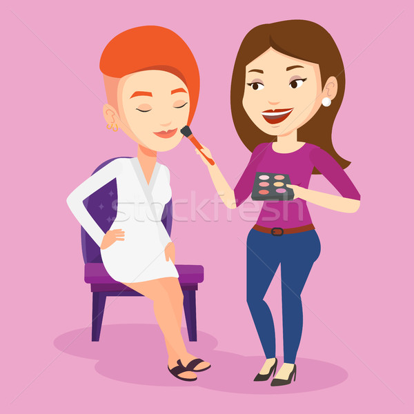 Visagiste doing makeup to young stylish girl. Stock photo © RAStudio