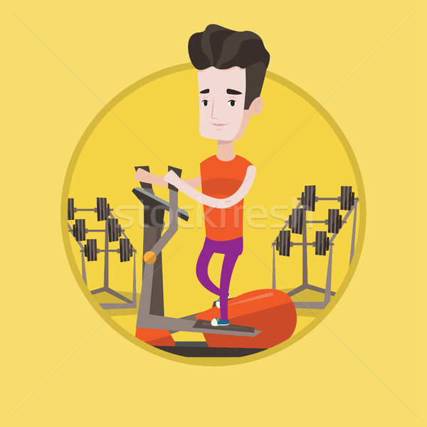 Man exercising on elliptical trainer. Stock photo © RAStudio
