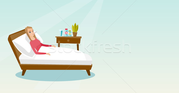 Sick woman with thermometer laying in bed. Stock photo © RAStudio