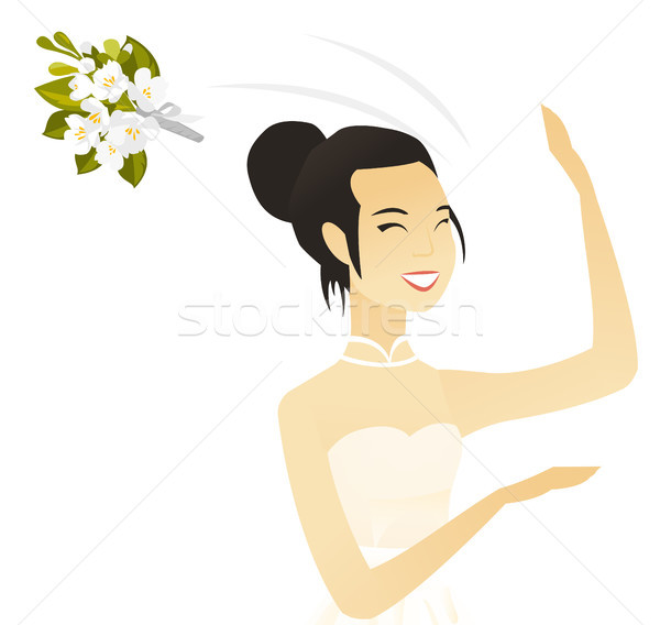 Young asian bride tossing a bouquet of flowers. Stock photo © RAStudio