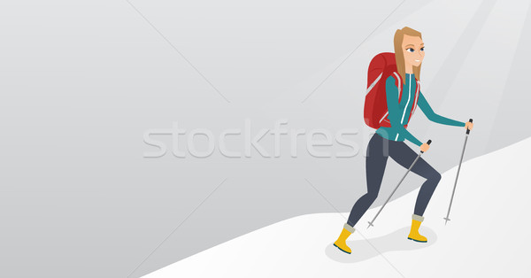 Caucasian mountaineer climbing a snowy ridge. Stock photo © RAStudio