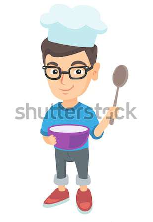 Asian boy holding a saucepan and a spoon. Stock photo © RAStudio