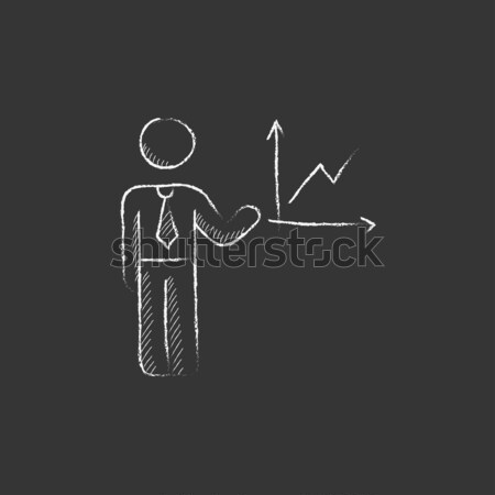 Businessman holding Euro and US dollar icon drawn in chalk. Stock photo © RAStudio